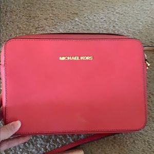 Red Michael Kors crossbody purse